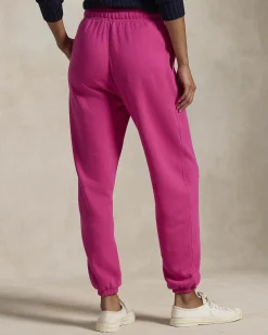 Pantaloni fucsia in felpa di cotone garzato con elastico al fondo e logo blu ricamato
