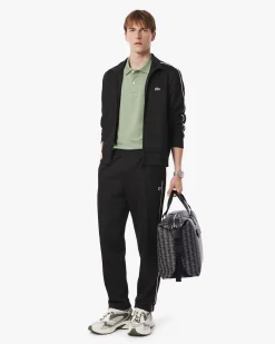 Pantaloni Lacoste neri in felpa piqué interlock di cotone con piping in contrasto