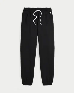 Pantaloni neri in felpa di cotone garzato con elastico al fondo e logo bianco ricamato