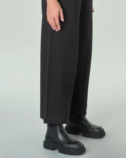 Pantaloni neri slim in misto viscosa punto Milano con risvolto al fondo ed elastico in vita