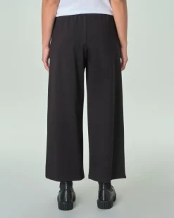 Pantaloni neri slim in misto viscosa punto Milano con risvolto al fondo ed elastico in vita