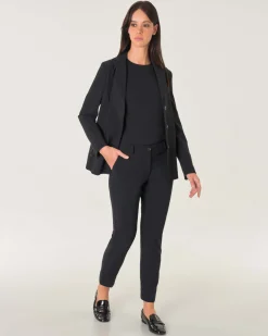 Pantaloni slim neri in tessuto tecnico lunghezza alla caviglia con spacchetti laterali