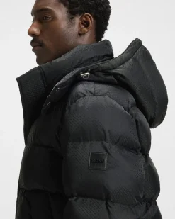 Piumino Boss nero in nylon idrorepellente con motivo monogramma in rilievo e cappuccio staccabile
