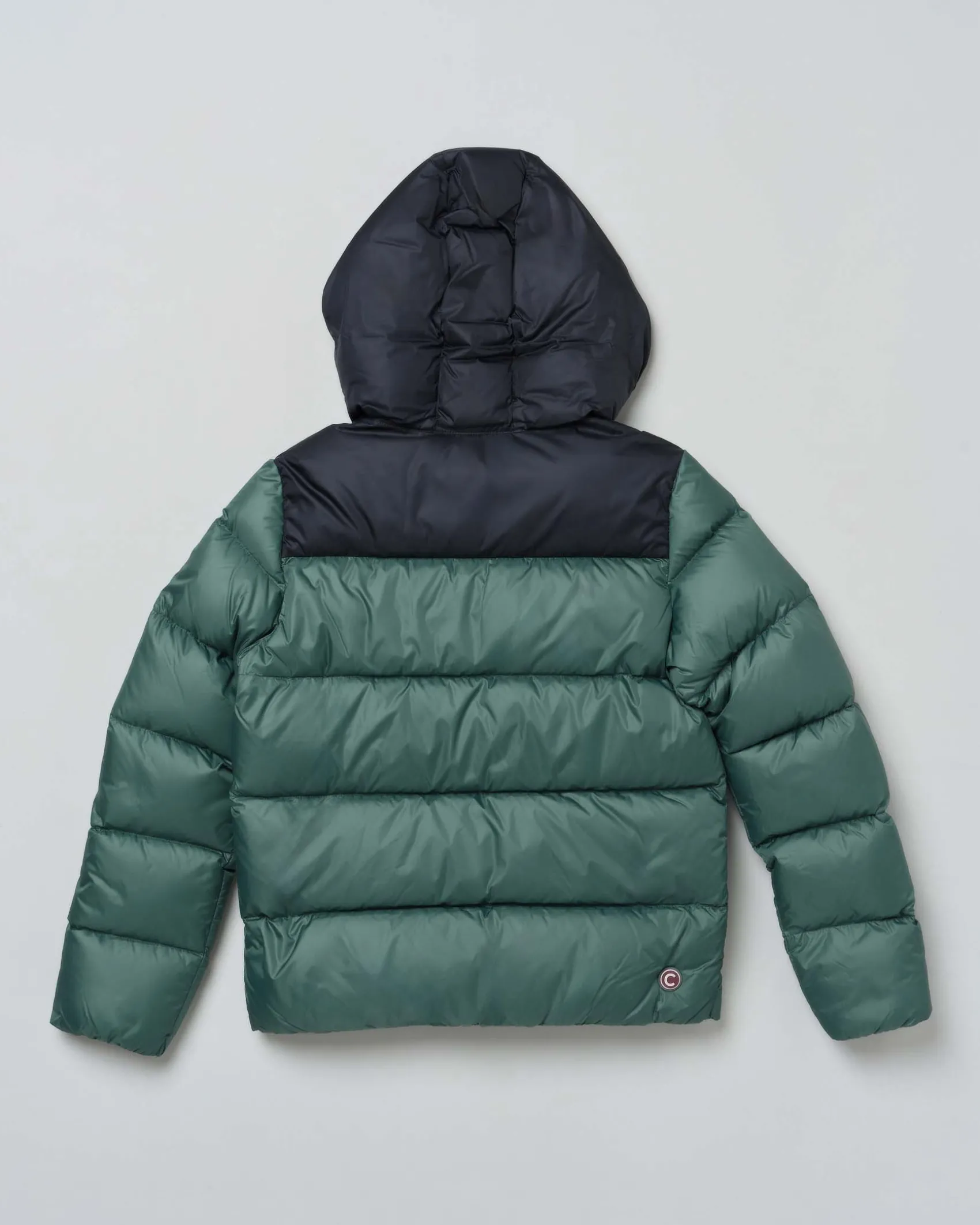 Piumino Colmar verde in nylon imbottito con inserto blu e cappuccio