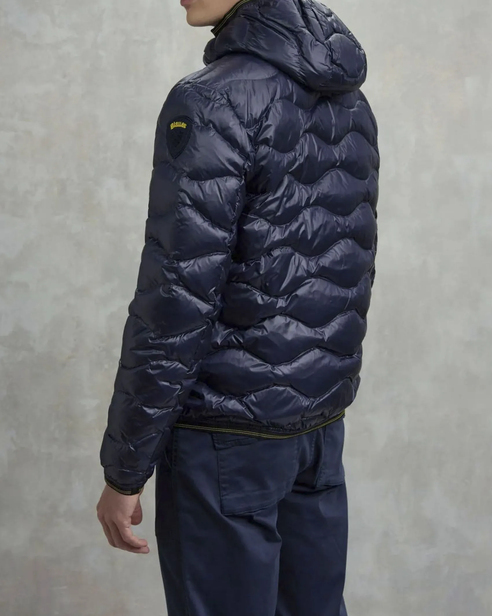 Piumino Wave Blauer blu con cappuccio fisso e trapuntatura ad onde