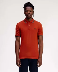 Polo Fred Perry arancione mezza manica con bordino verde acqua e blu