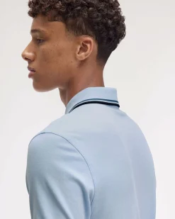 Polo Fred Perry azzurra mezza manica con bordino blu e ottanio