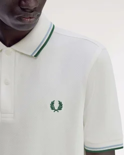 Polo Fred Perry bianca mezza manica con bordino verde e azzurro