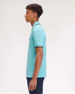 Polo Fred Perry color acqua mezza manica con bordino blu e militare