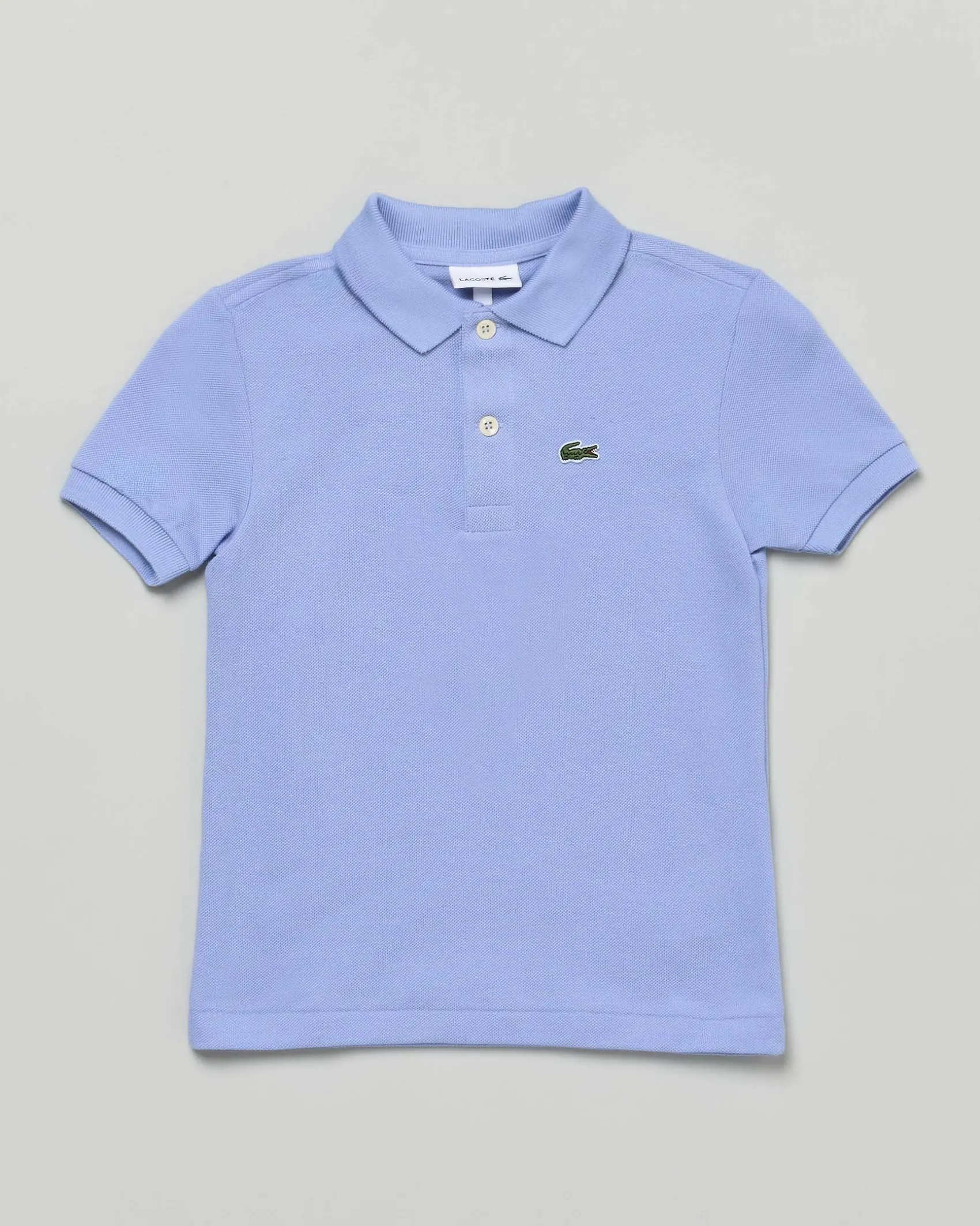 Polo Lacoste celeste piqué di puro cotone