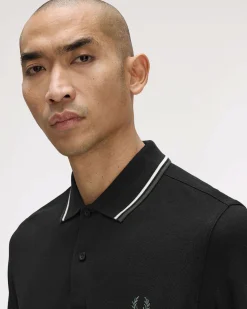 Polo manica lunga Fred Perry nera con bordino bianco e militare