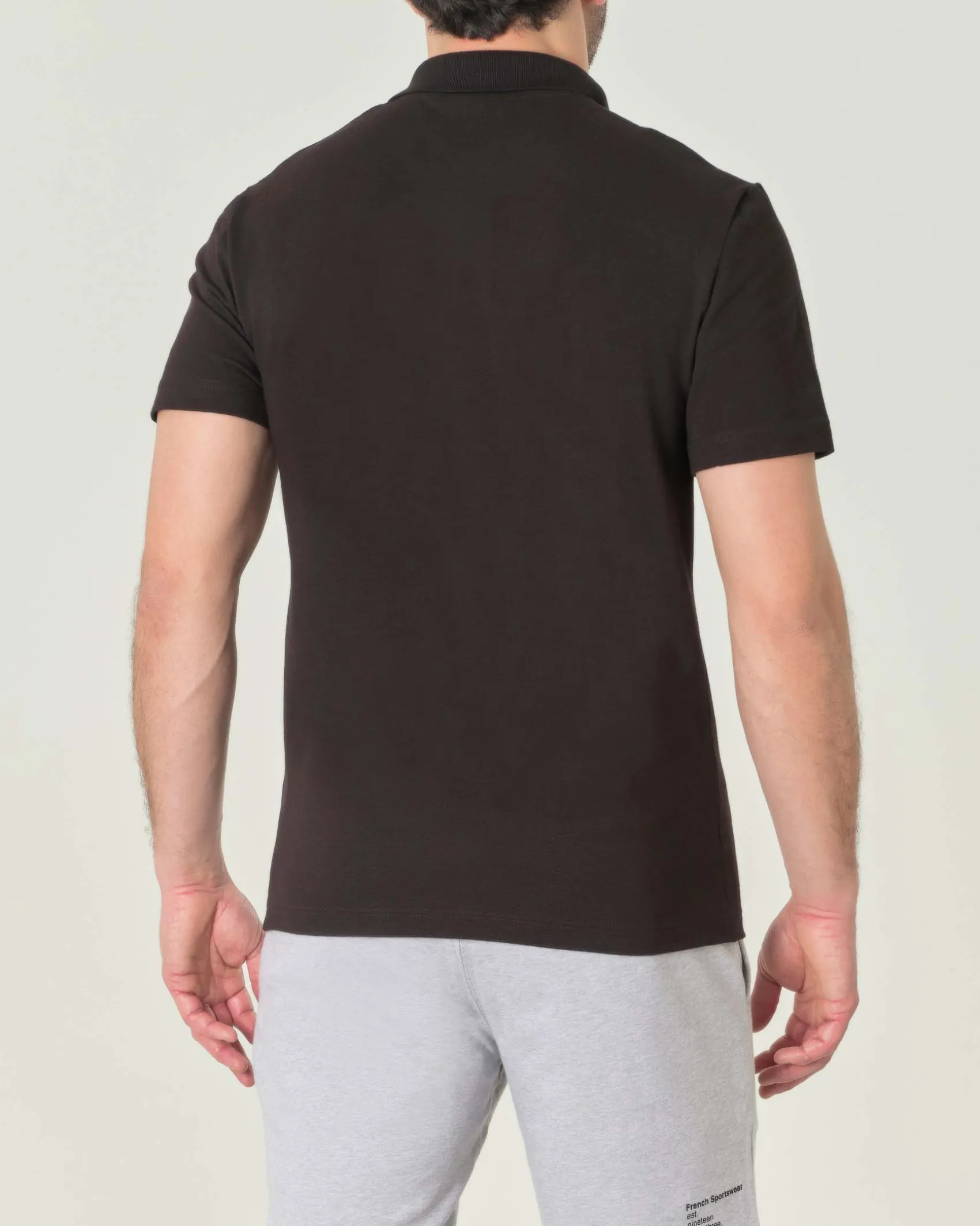 Polo mezza manica nera in cotone organico stretch punto wafer
