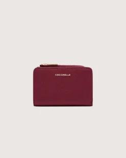 Portafoglio bordeaux Coccinelle in pelle bottolata