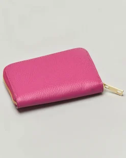 Portafoglio fucsia in pelle martellata con chiusura a cerniera