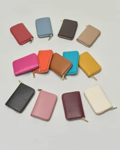 Portafoglio fucsia in pelle martellata con chiusura a cerniera