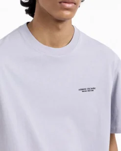 T-shirt mezza manica Armani Exchange lilla tinta unita con logo piccolo stampato sul petto