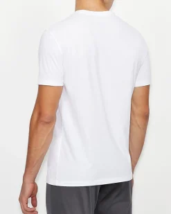 T-shirt Armani Exchange bianca in cotone con logo AX stampato in contrasto sul petto