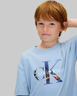 T-shirt Calvin Klein celeste in puro cotone con scritta logo monogram multicolor