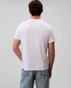 T-shirt Calvin Klein Jeans bianca in cotone con patch logo applicato sul petto