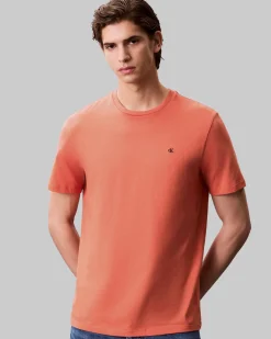 T-shirt Calvin Klein Jeans arancione in cotone con logo ricamato sul petto