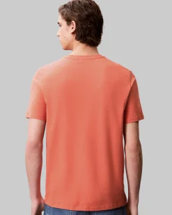 T-shirt Calvin Klein Jeans arancione in cotone con logo ricamato sul petto