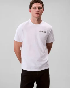 T-shirt Calvin Klein Jeans bianca in cotone con logo stampato sul petto e maxi grafica sul retro