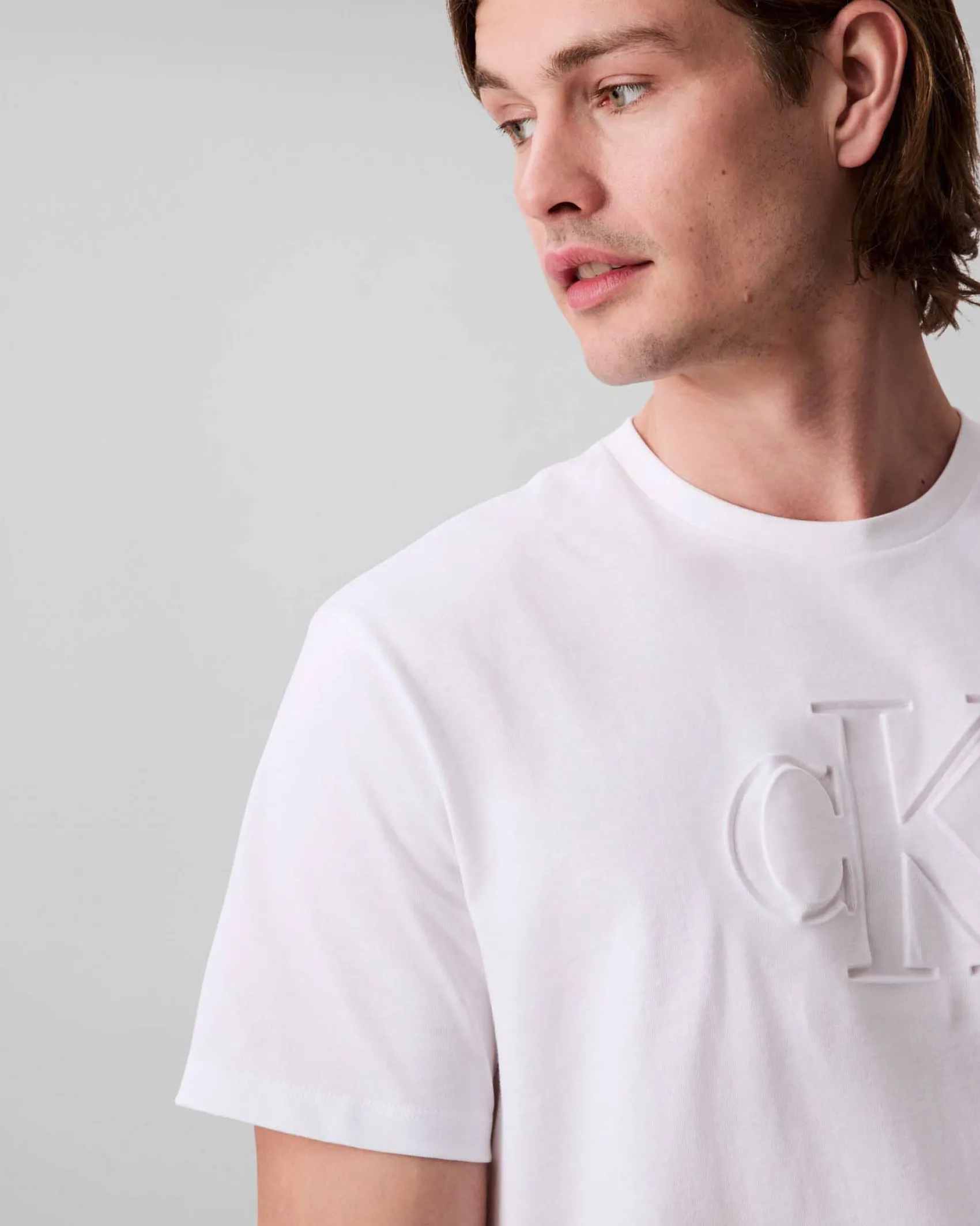T-shirt Calvin Klein Jeans bianca in cotone con logo monogramma impresso in tono davanti