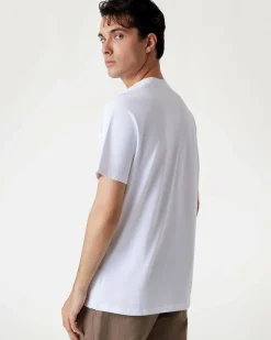 T-shirt Guess bianca in cotone con stampa logo triangolo frontale