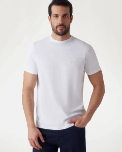 T-shirt Guess bianca in cotone elasticizzato con logo piccolo ricamato in tono