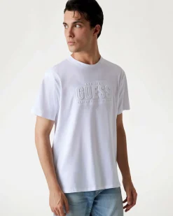 T-shirt Guess bianca in cotone con logo scritta in rilievo sul petto