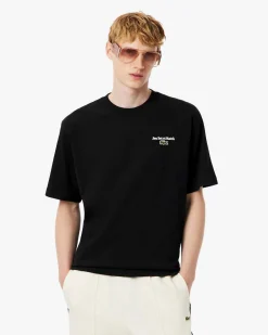 T-shirt Lacoste loose-fit nera con stampa scritta ispirata al tennis