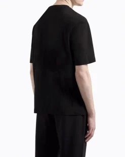 T-shirt mezza manica Armani Exchange nera con taschino e logo AX al petto
