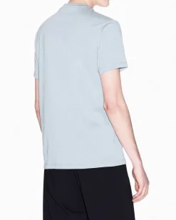 T-shirt mezza manica Armani Exchange color acqua in cotone con logo AX stampato in contrasto sul petto