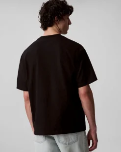 T-shirt relaxed-fit Calvin Klein Jeans nera in cotone con logo scritta in rilievo