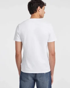 T-shirt slim mezza manica Guess Jeans bianca in puro cotone con logo scritta