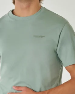 T-shirt verde acqua mezza manica tinta unita con logo piccolo stampato sul petto