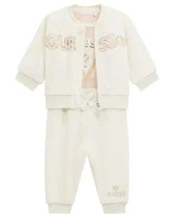 Tuta Guess bianca e rosa in tessuto teddy con body