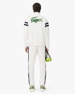 Tuta Lacoste bianca con righe blu in taffetà a rombi di poliestere riciclato