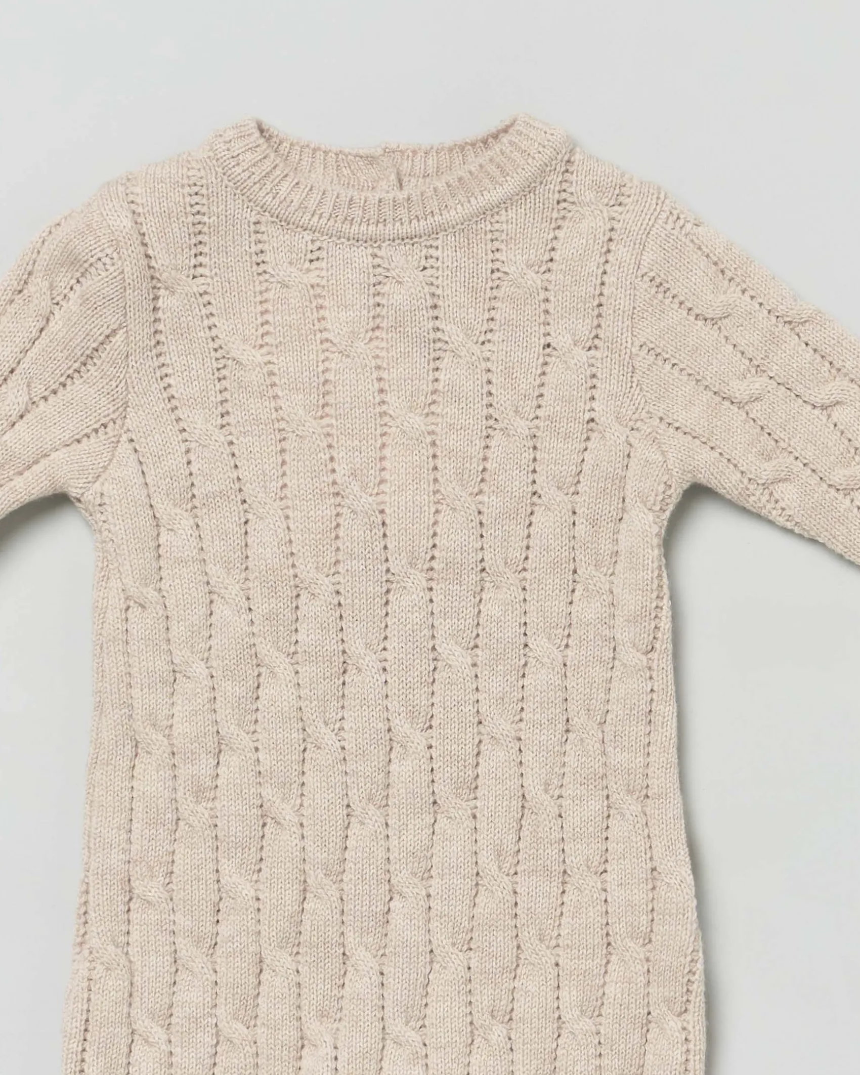 Tutina beige in pura lana a trecce a maniche lunghe