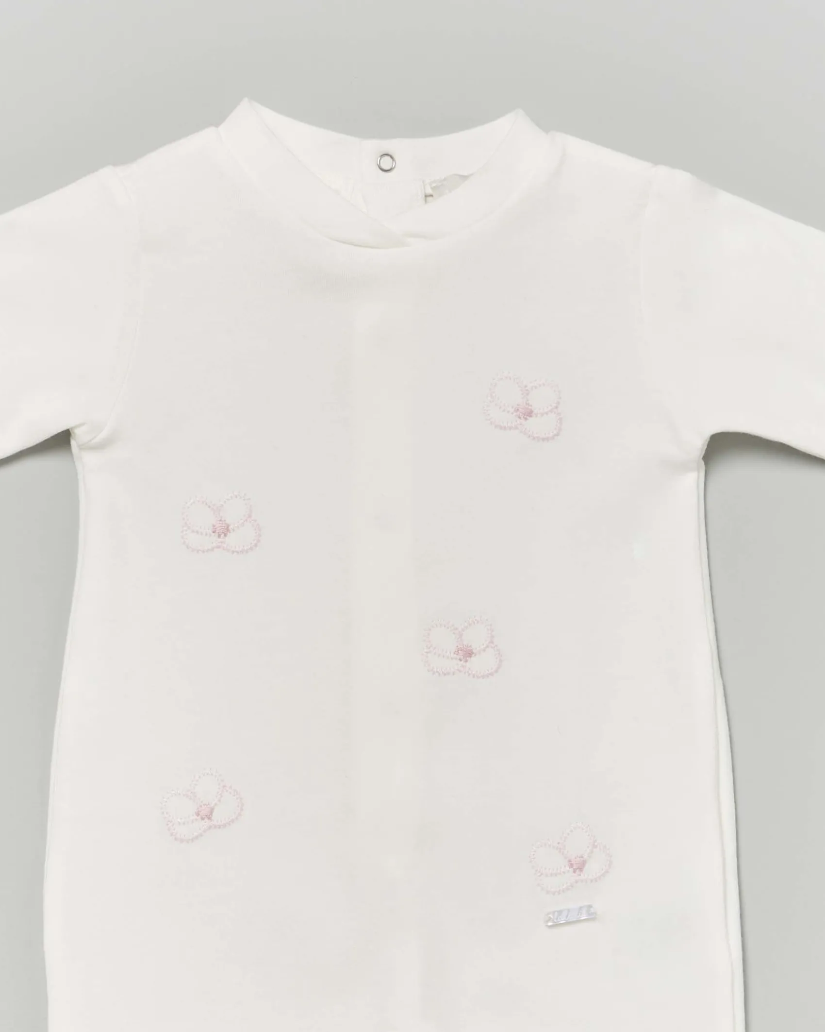 Tutina Lalalù avorio in cotone stretch con fiori rosa ricamati